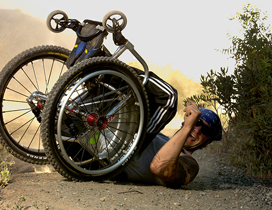 Man in a wheelchair tackling some extreme offroad trails
