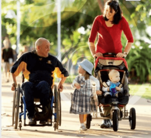 family using wheelchair and stroller