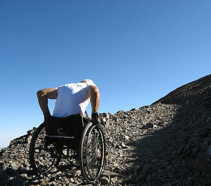 Wheelchair hiker on steep & rough trail